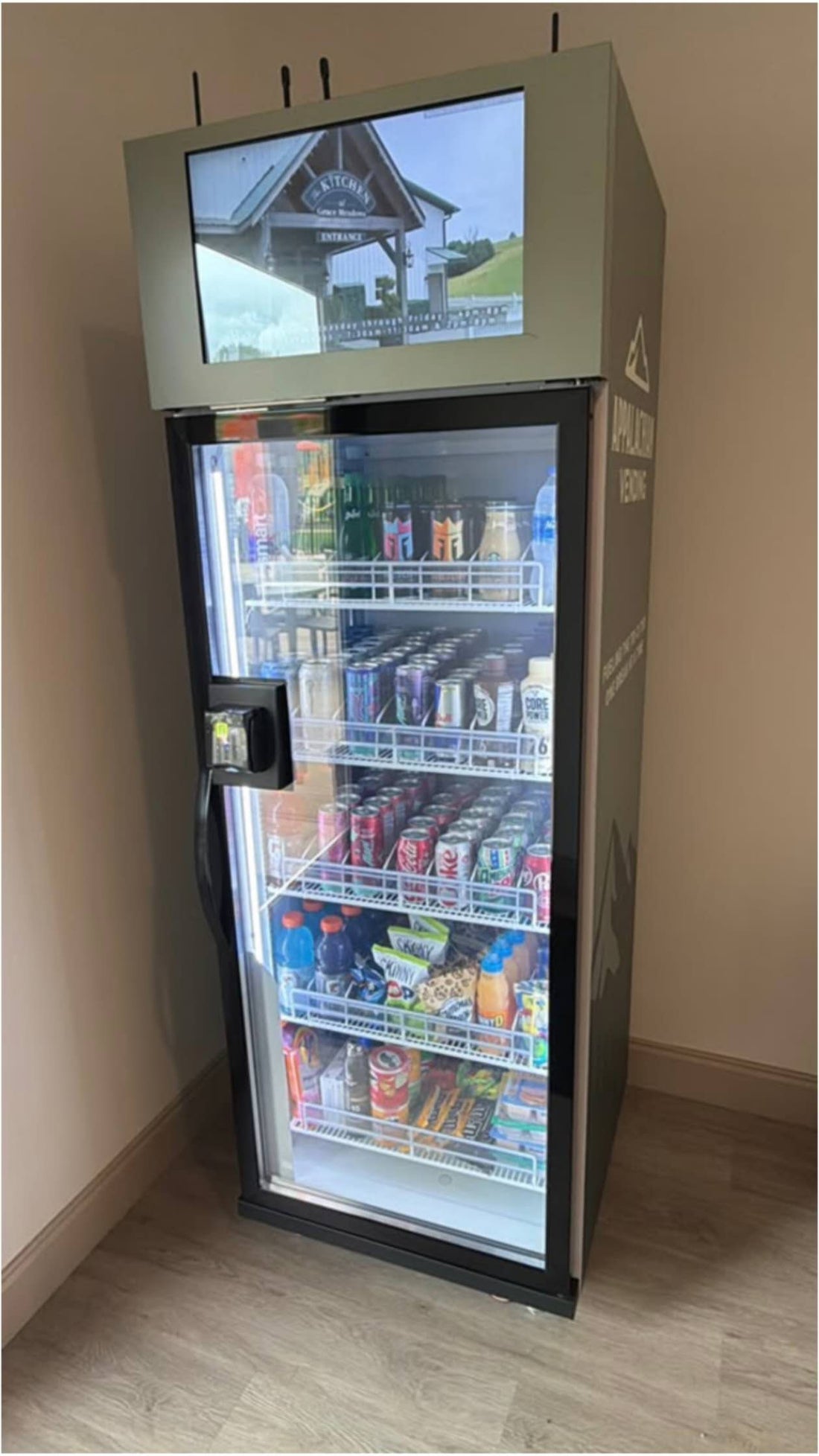 WEIMI AI vending machine serving snacks and drinks in a United States office