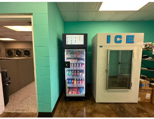 WEIMI AI vending machine stocked with snacks and drinks beside laundry equipment at a U.S. installation